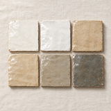 Six neutral handmade zellige tiles in the Trade Sample Box: off-white, blanc white, sable beige, sahara beige, argile greige and earthy gray