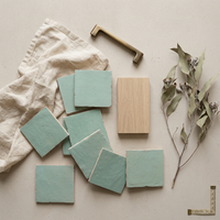 Seafoam Green Zellige Square 4x4 tiles styled on a designer mood board with linen, brass, and oak