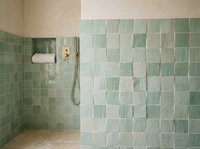 Seafoam Green Zellige Square 4x4 on a handmade Moroccan bathroom shower wall