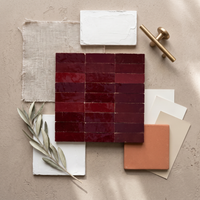 Burgundy Talia Zellige Mosaic Sheet styled on a designer mood board with linen, brass, and plaster