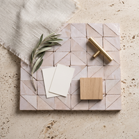 Pinwheel Triangle Zellige Mosaic Tile, Blush & Ivory, styled on a designer mood board with linen, brass, and oak