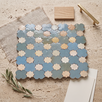 Star and Cross Zellige Mosaic Tile, Sea Teal & Cream, styled on a designer mood board with linen, brass, and oak