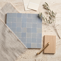 Classic Square Zellige Mosaic Tile, Slate Grey, styled on a designer mood board with linen, brass, and oak