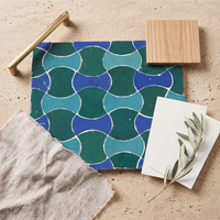 Bowtie Zellige Mosaic Tile, Emerald, Turquoise & Cobalt, styled on a designer mood board with linen, brass, and oak