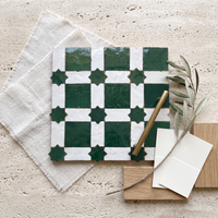 Star Checkerboard Zellige Mosaic Tile, Emerald & White, styled on a designer mood board with linen, brass, and oak