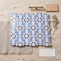 Andalusian Star Rosette Zellige Mosaic Tile, Periwinkle, White & Black, styled on a designer mood board with linen, brass, and oak