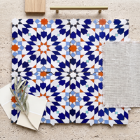 16 Point Star Rosette Zellige Mosaic Tile, Cobalt, Orange & White, styled on a designer mood board with linen, brass, and oak