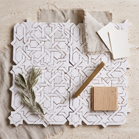 Interlaced Star Zellige Mosaic Tile, White, styled on a designer mood board with linen, brass, and oak