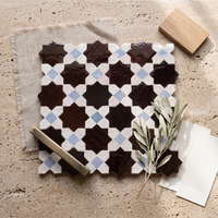 8 Point Star Zellige Mosaic Tile, Chocolate, White & Sky Blue, styled on a designer mood board with linen, brass, and oak
