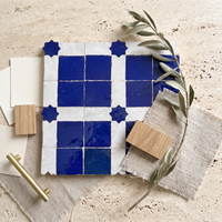 Square and Star Grid Zellige Mosaic Tile, Cobalt & White, styled on a designer mood board with linen, brass, and oak