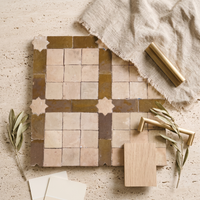 Square and Star Grid Zellige Mosaic Tile, Honey & Cream, styled on a designer mood board with linen, brass, and oak