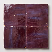 Close up of four Mulberry Purple Zellige Square 4x4 tiles showing glaze variation
