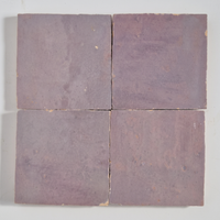 Close up of four Lilac Mauve Zellige Square 4x4 tiles showing glaze variation