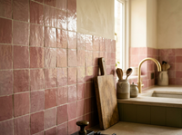 Peony Pink Zellige Square 4x4 installed as a handmade Moroccan kitchen backsplash with olive cabinetry and brass tap