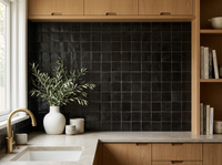 Matte Black Zellige Square 4x4 installed as a handmade Moroccan kitchen backsplash with white oak cabinetry and brass tap